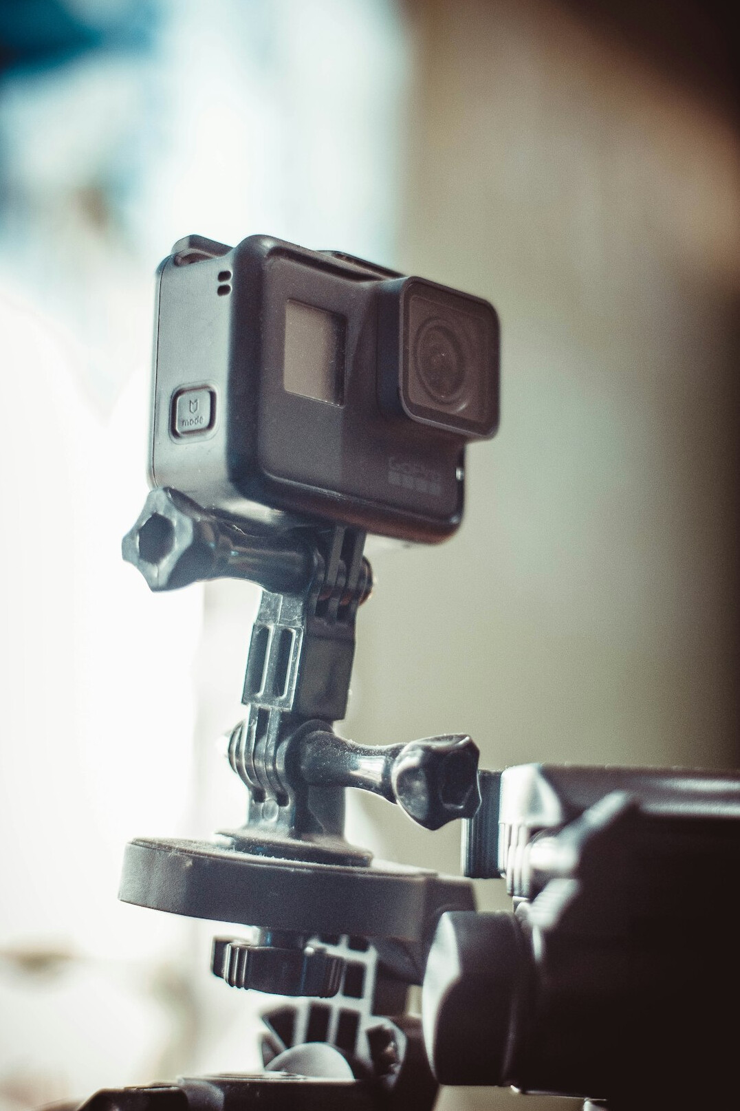 Camera operator filming a live broadcast on a professional pedestal camera