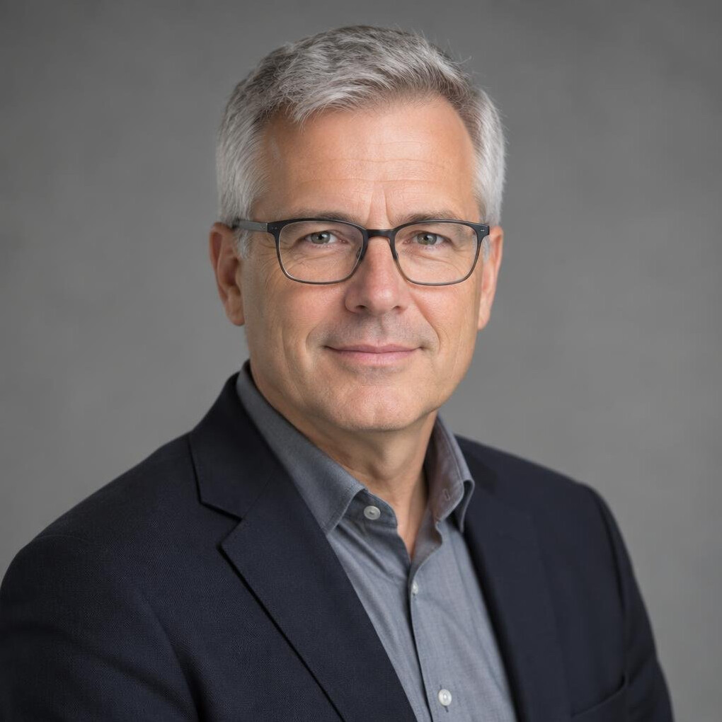 Swiss man in his fifties with glasses, video engineer portrait