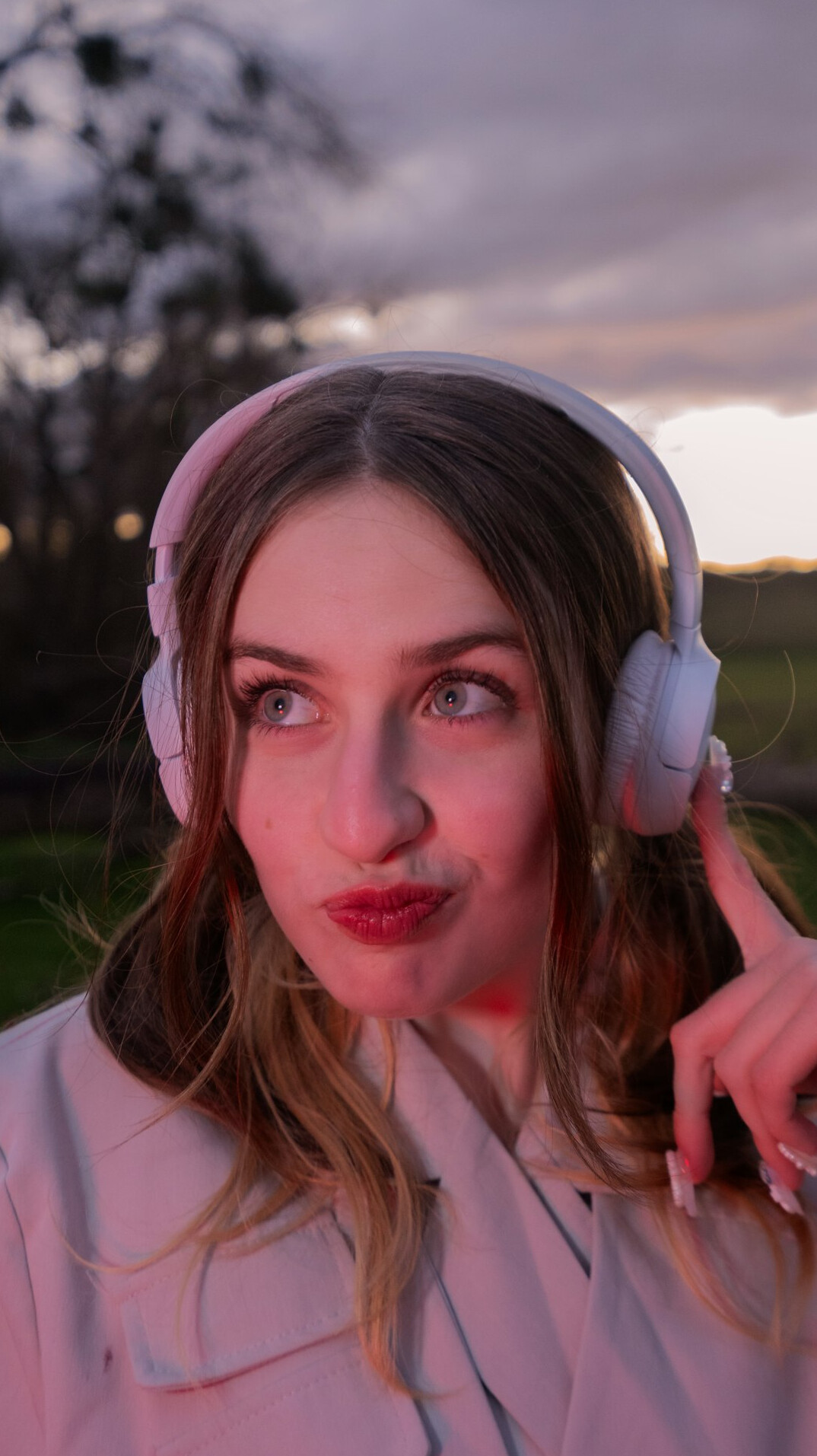 Swiss woman in her thirties wearing a headset, broadcast director portrait